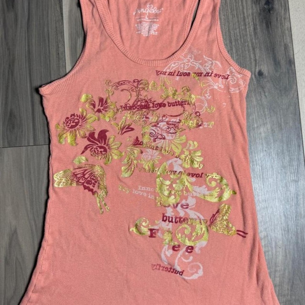 Y2K Angels coral pink tank top featuring a gold floral and text graphic